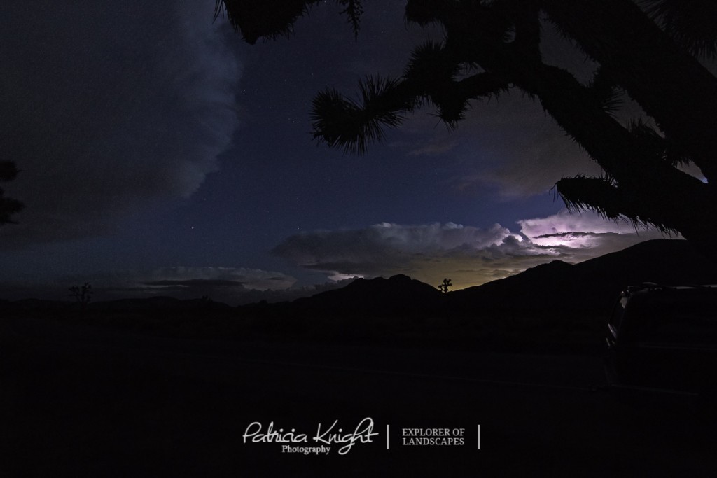 Lightning in the distance as night falls on the desert